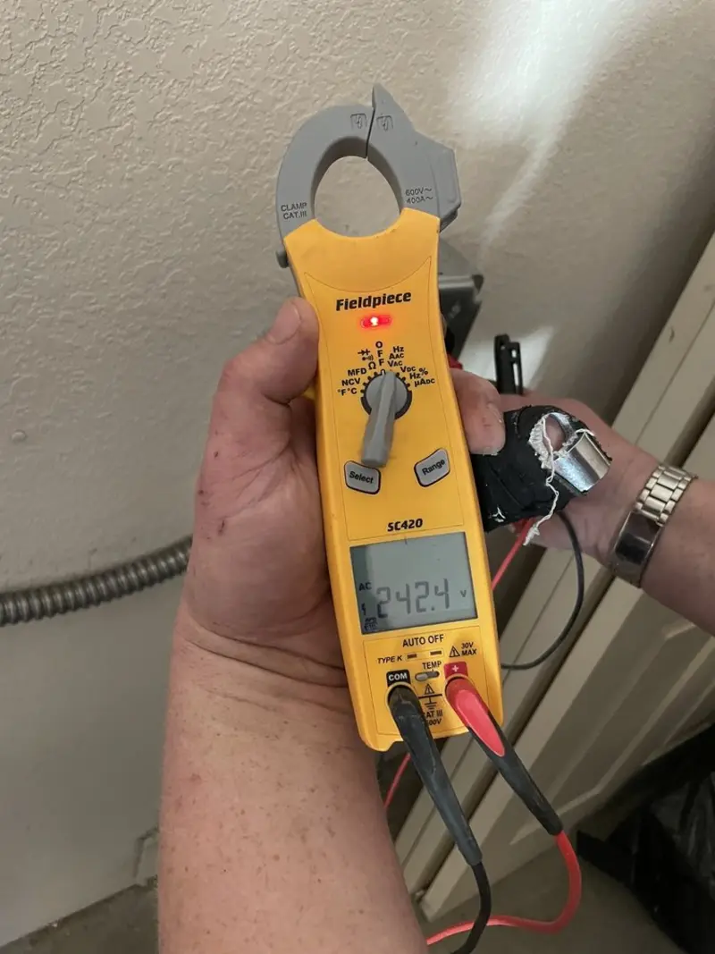Voltage testing with clamp meter during Electrical Installation Services in Fort Meade